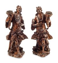 A Pair of Continental Carved Wood Figural Prickets
