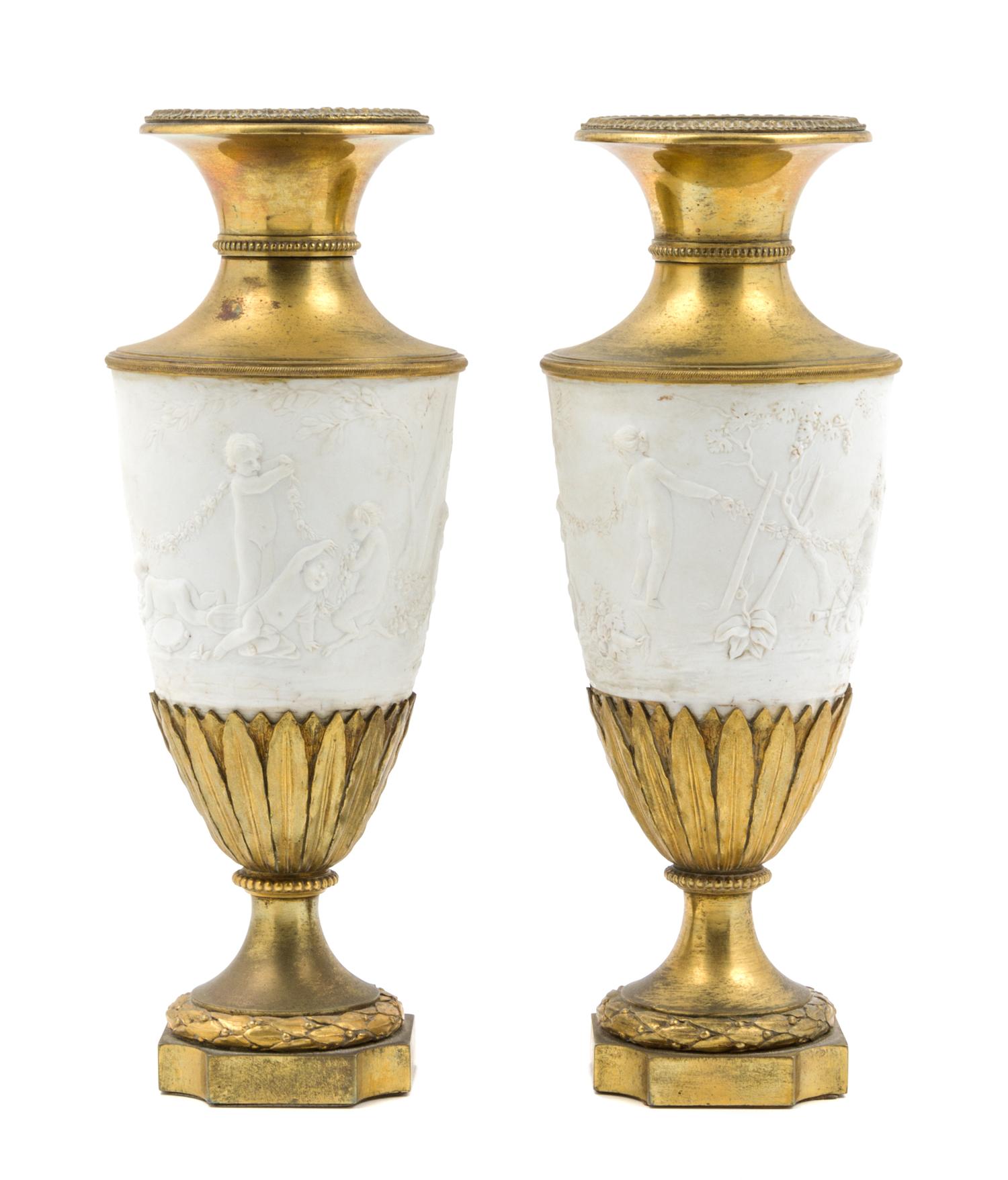 A Pair of Gilt Bronze Mounted Bisque Porcelain Vases Height 11 inches.