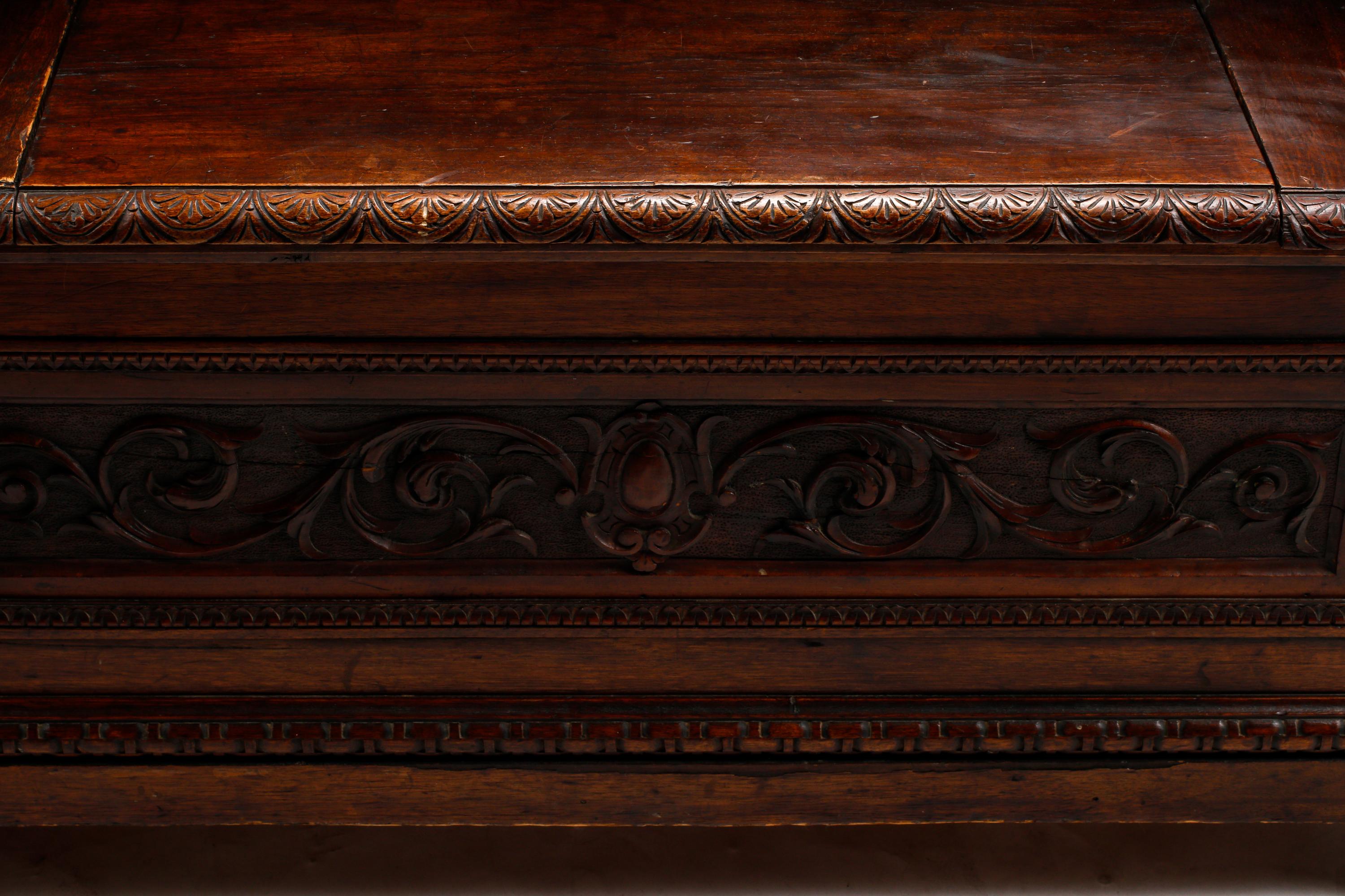 An Italian Renaissance Revival Carved Walnut Settle