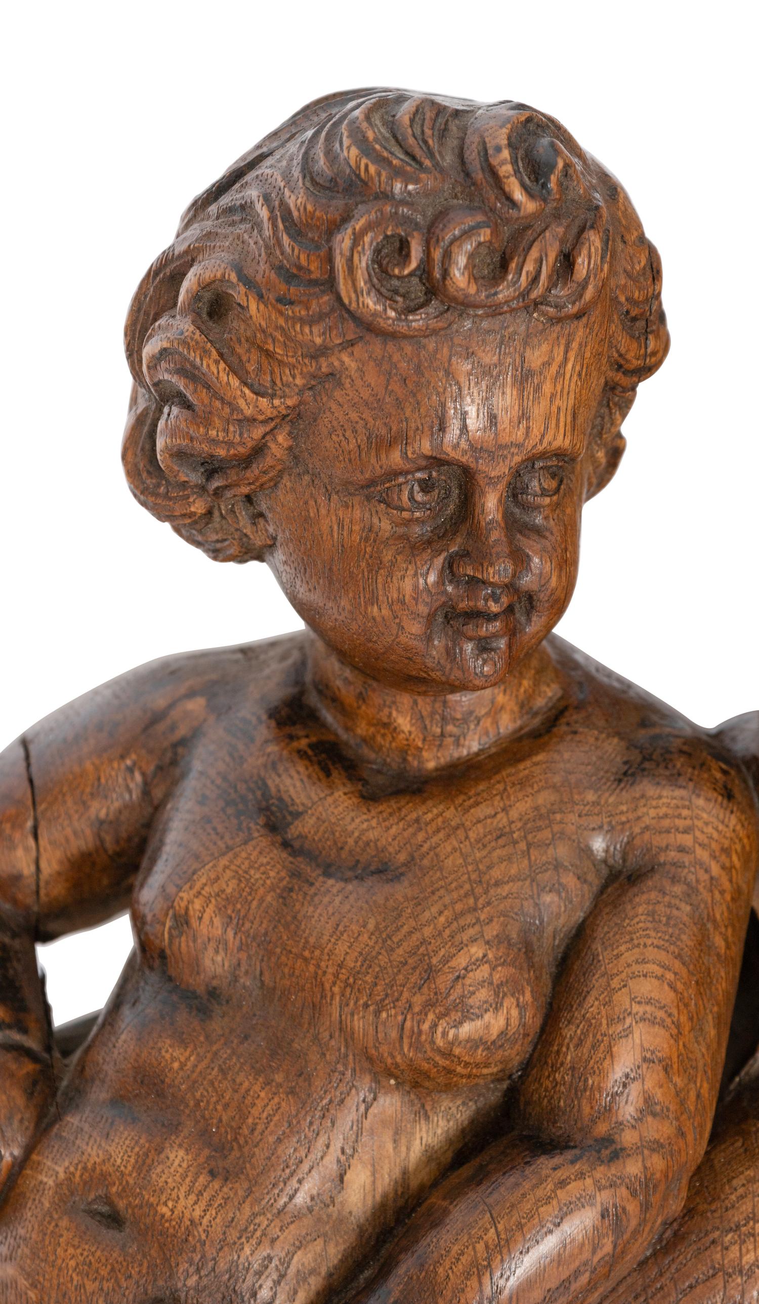 A Continental Carved Oak Figural Clock Case