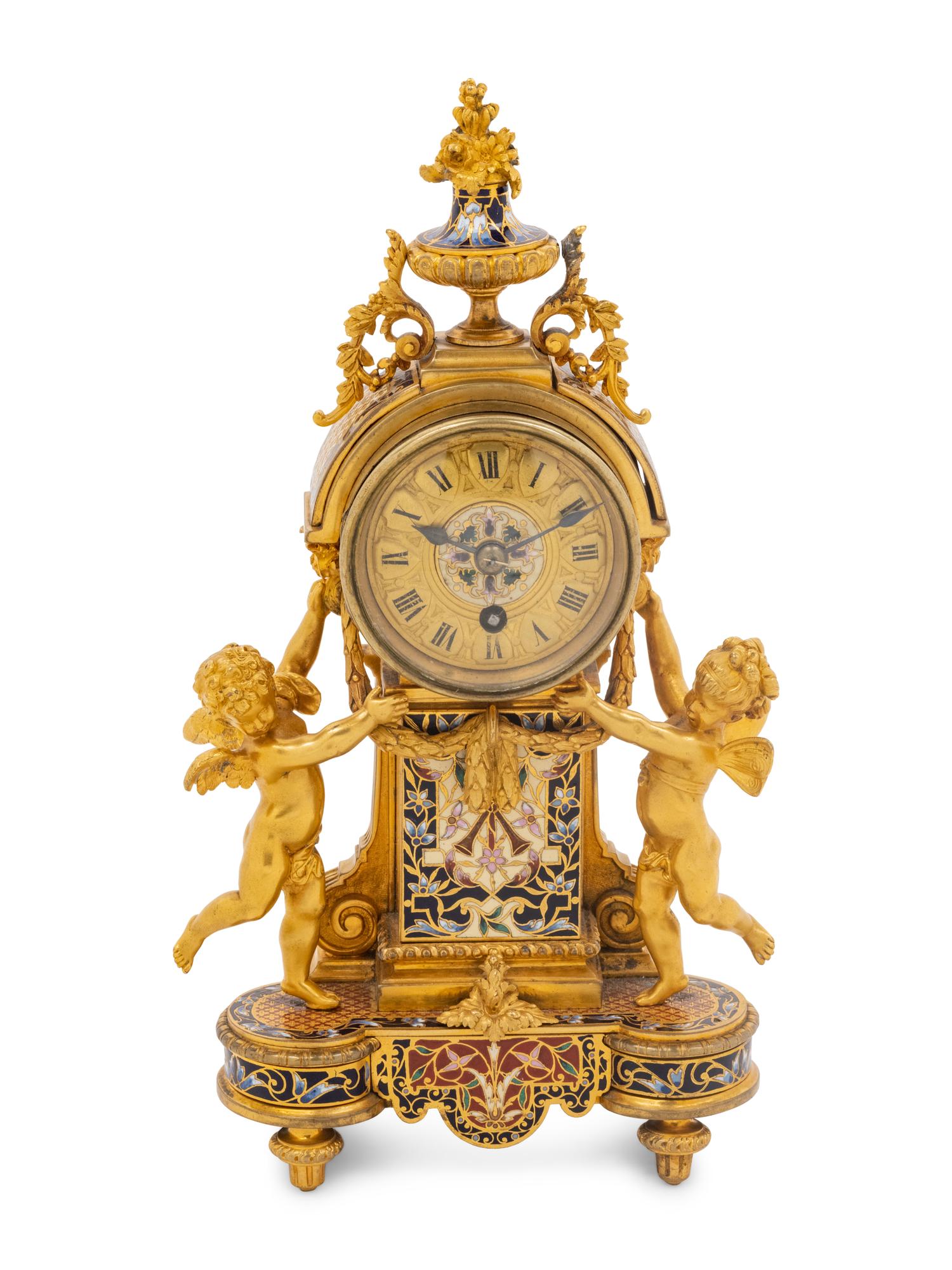 A French Gilt Bronze and Champlevé Figural Mantel Clock
