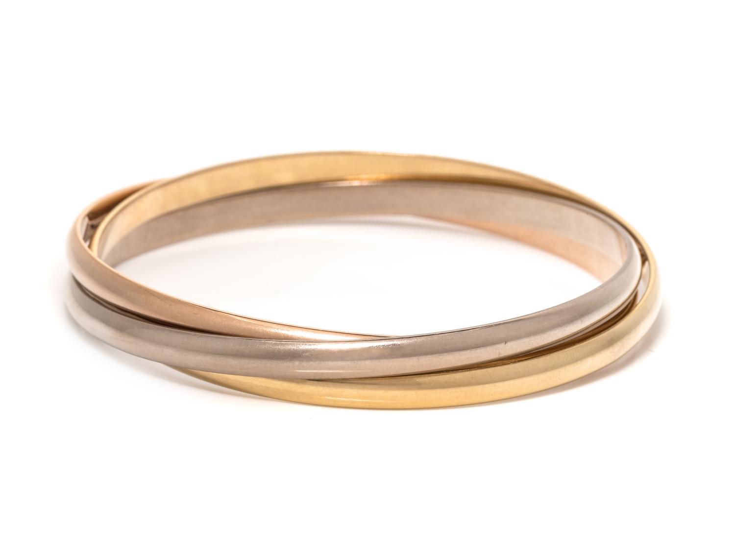 CARTIER, TRICOLOR GOLD 'TRINITY' BANGLE BRACELET