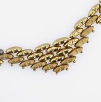 A group of gold necklaces