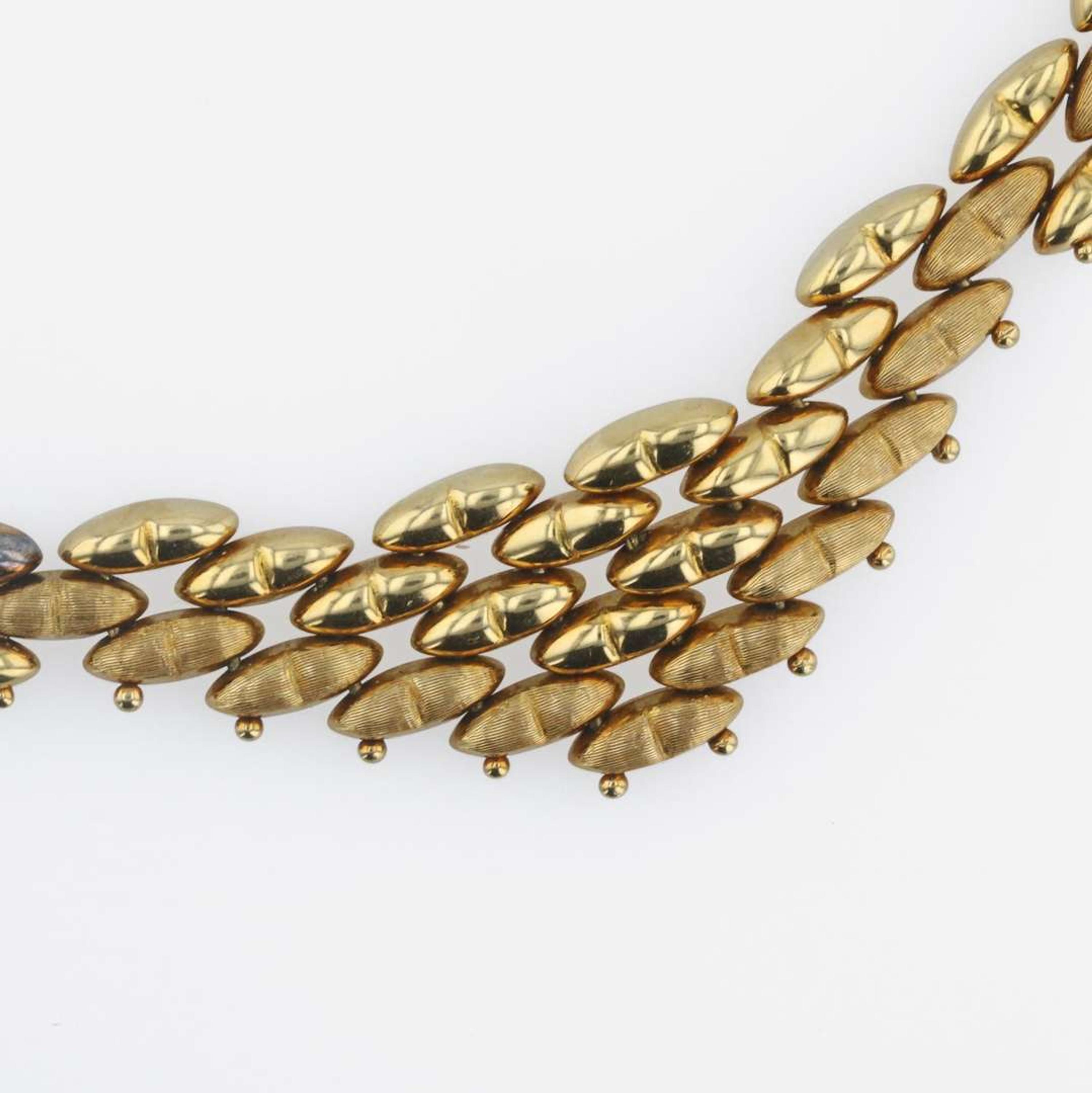 A group of gold necklaces