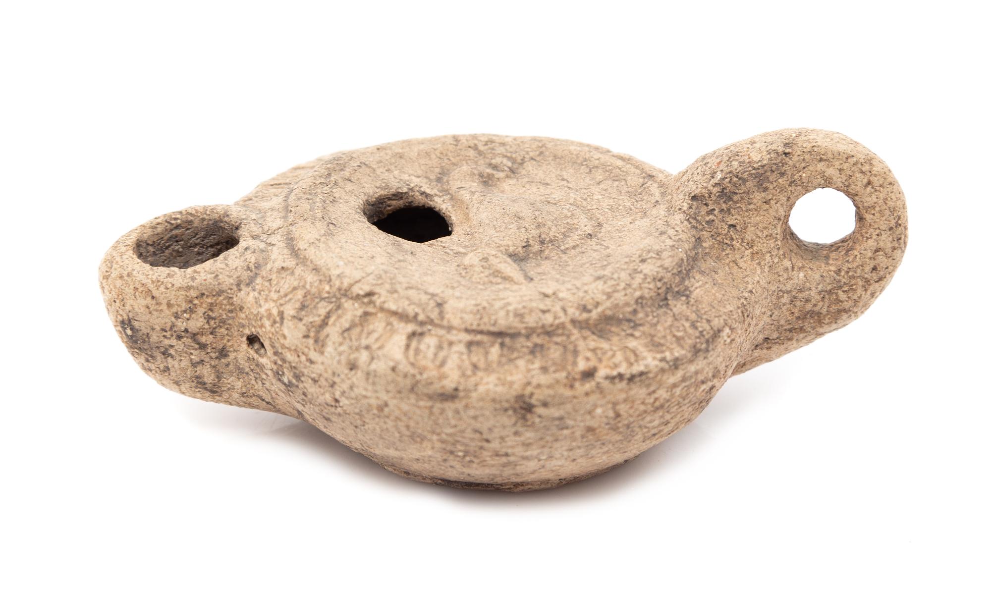 A Roman Style Terracotta Oil Lamp