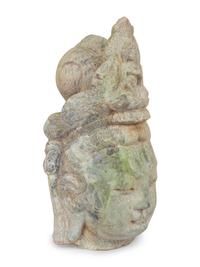 A Chinese Carved and Weathered Marble Head of Guanyin