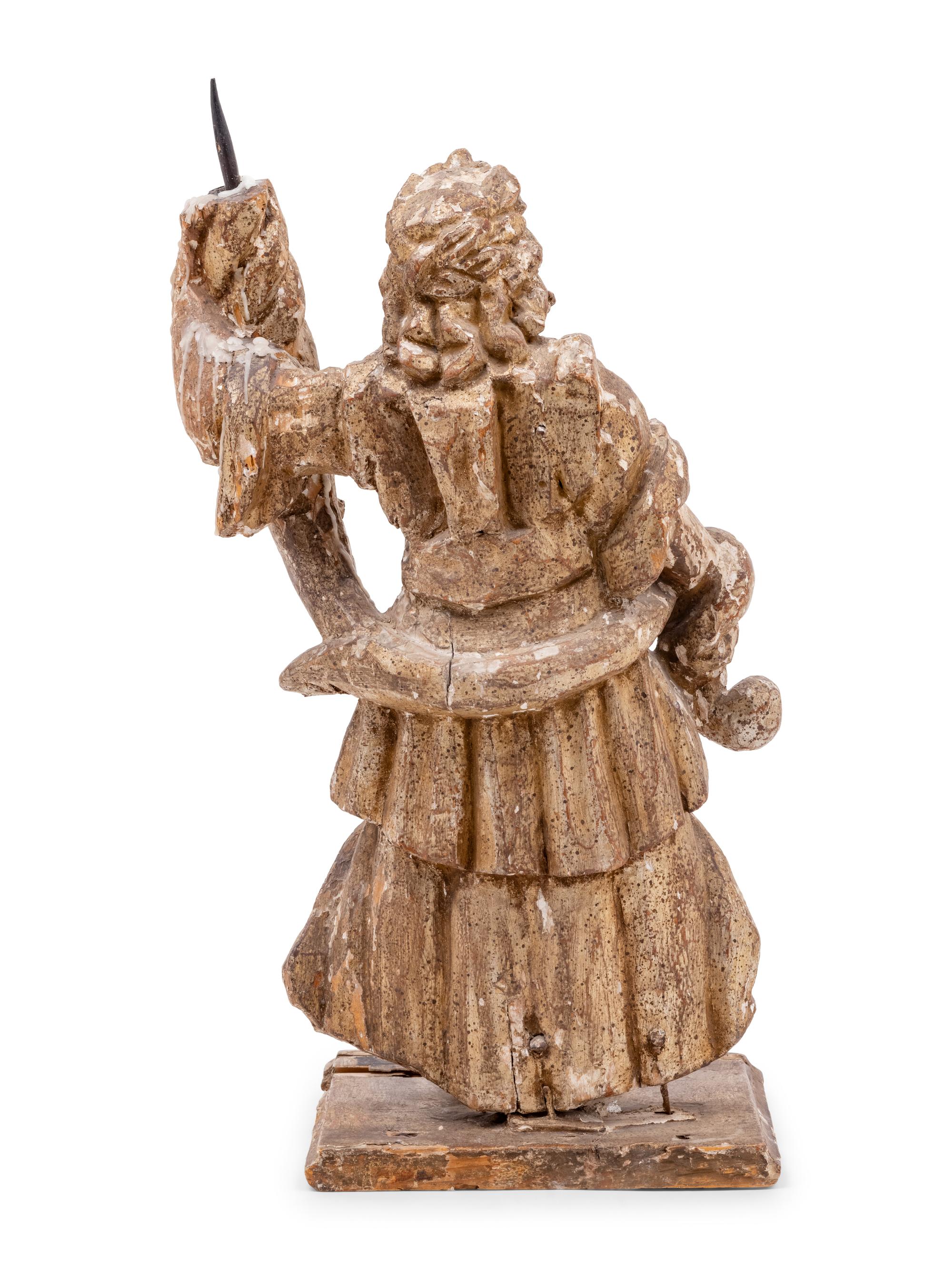 A Continental Carved Santo Figure with Remnants of Polychrome