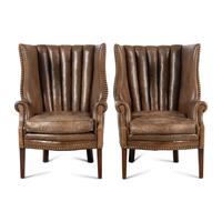 A Pair of Leather Upholstered Wingback Chairs
