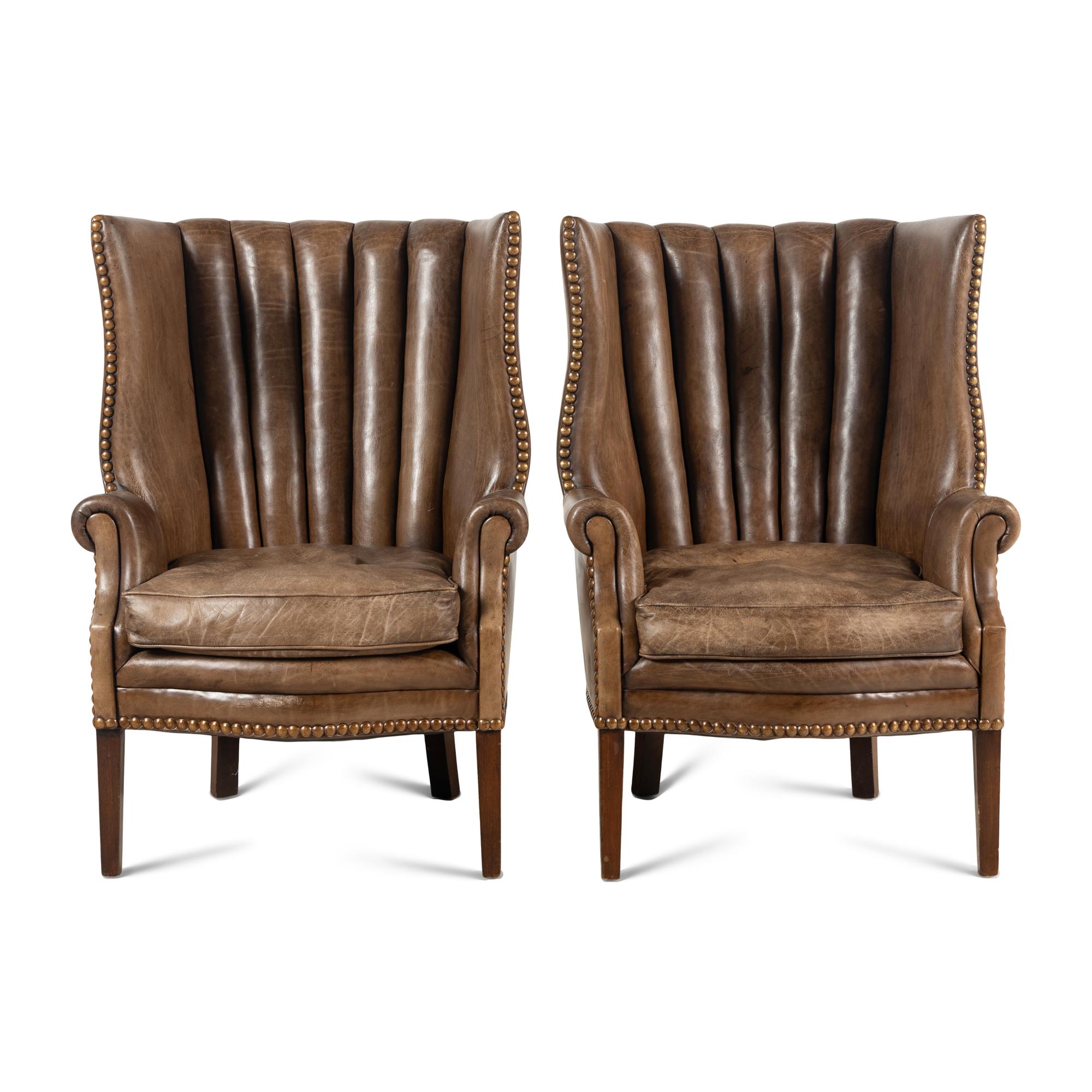A Pair of Leather Upholstered Wingback Chairs