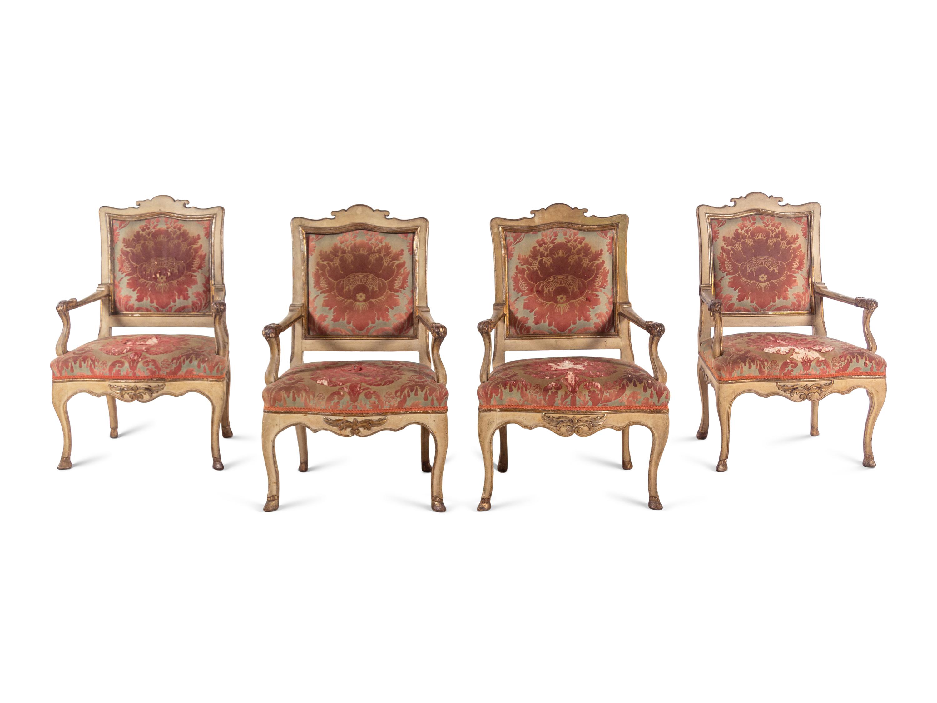 A Set of Four Italian Cream-Painted and Parcel Gilt Armchairs