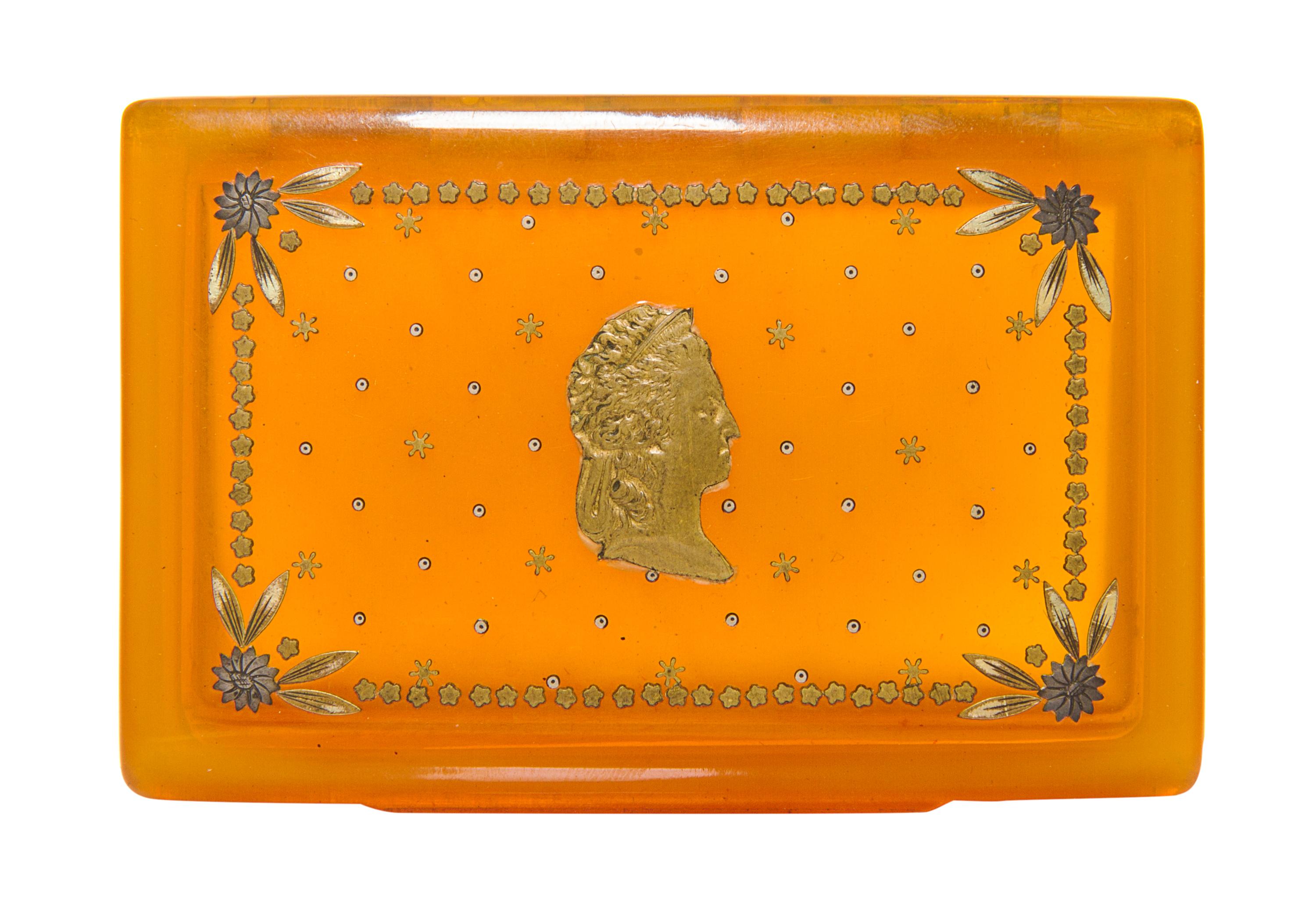 A Silver Inlaid Blond Tortoise Shell Box, 19th Century, of rectangular form, the hinged lid inset with a profile of a classical lady.