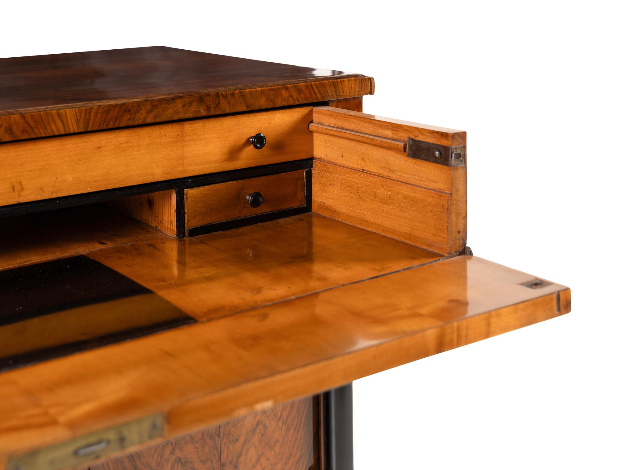 An Austrian Walnut and Part-Ebonized Bureau Commode