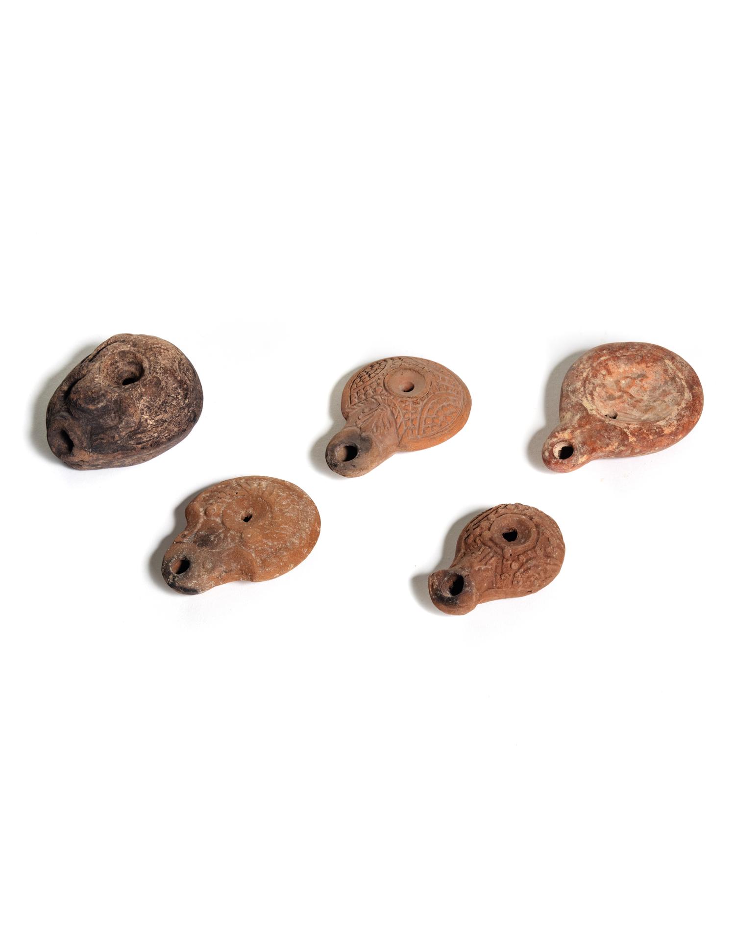 Five Roman Molded Terra Cotta Oil Lamps