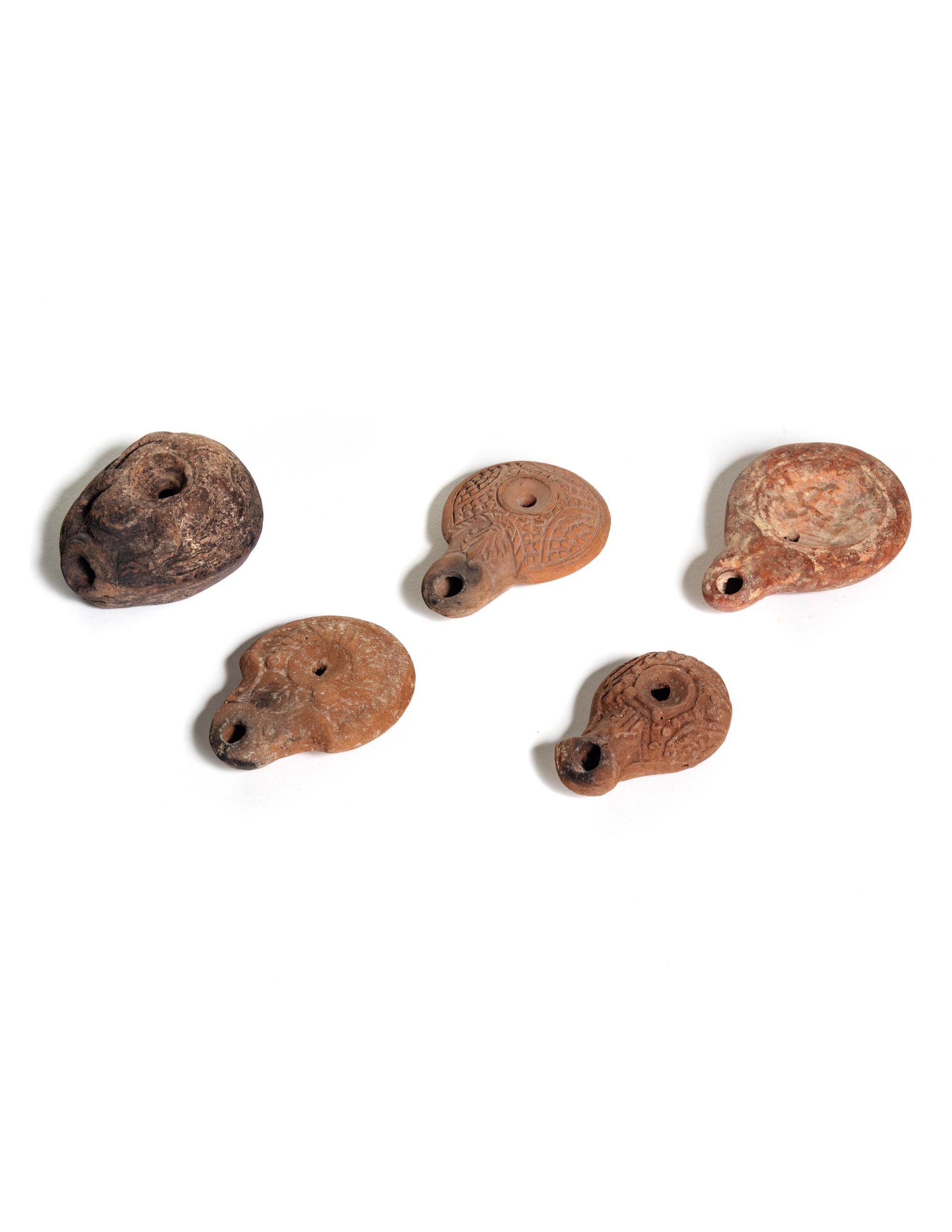 Five Roman Molded Terra Cotta Oil Lamps