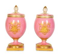 A Pair of English or Continental Porcelain Pink-Glazed Urns