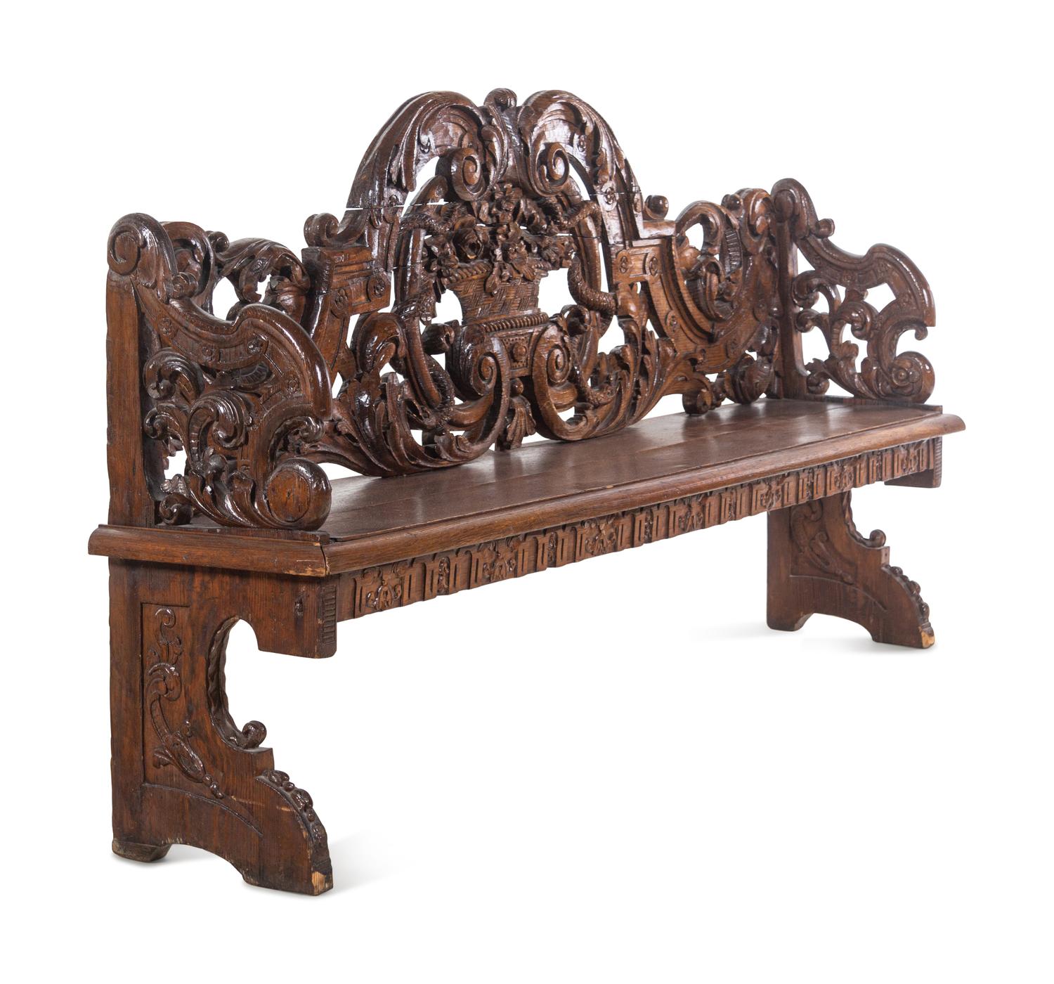A Jacobean Style Carved Oak Hall Bench