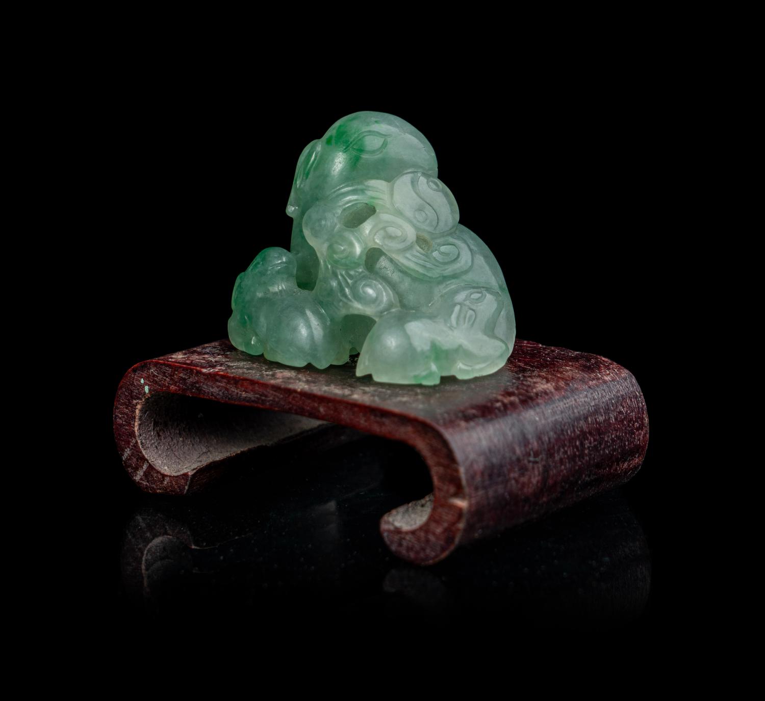 A Chinese Semi-Translucent Apple Green and Pale Celadon Jadeite 'Three Rams' Figural Group