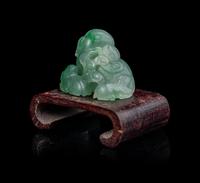A Chinese Semi-Translucent Apple Green and Pale Celadon Jadeite 'Three Rams' Figural Group