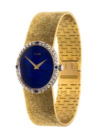 An 18 Karat Yellow Gold, Lapis Lazuli, Diamond and Sapphire Wristwatch, Piaget, 37.70 dwts.
