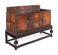 A Spanish Baroque Style Leather-Veneered Side Cabinet