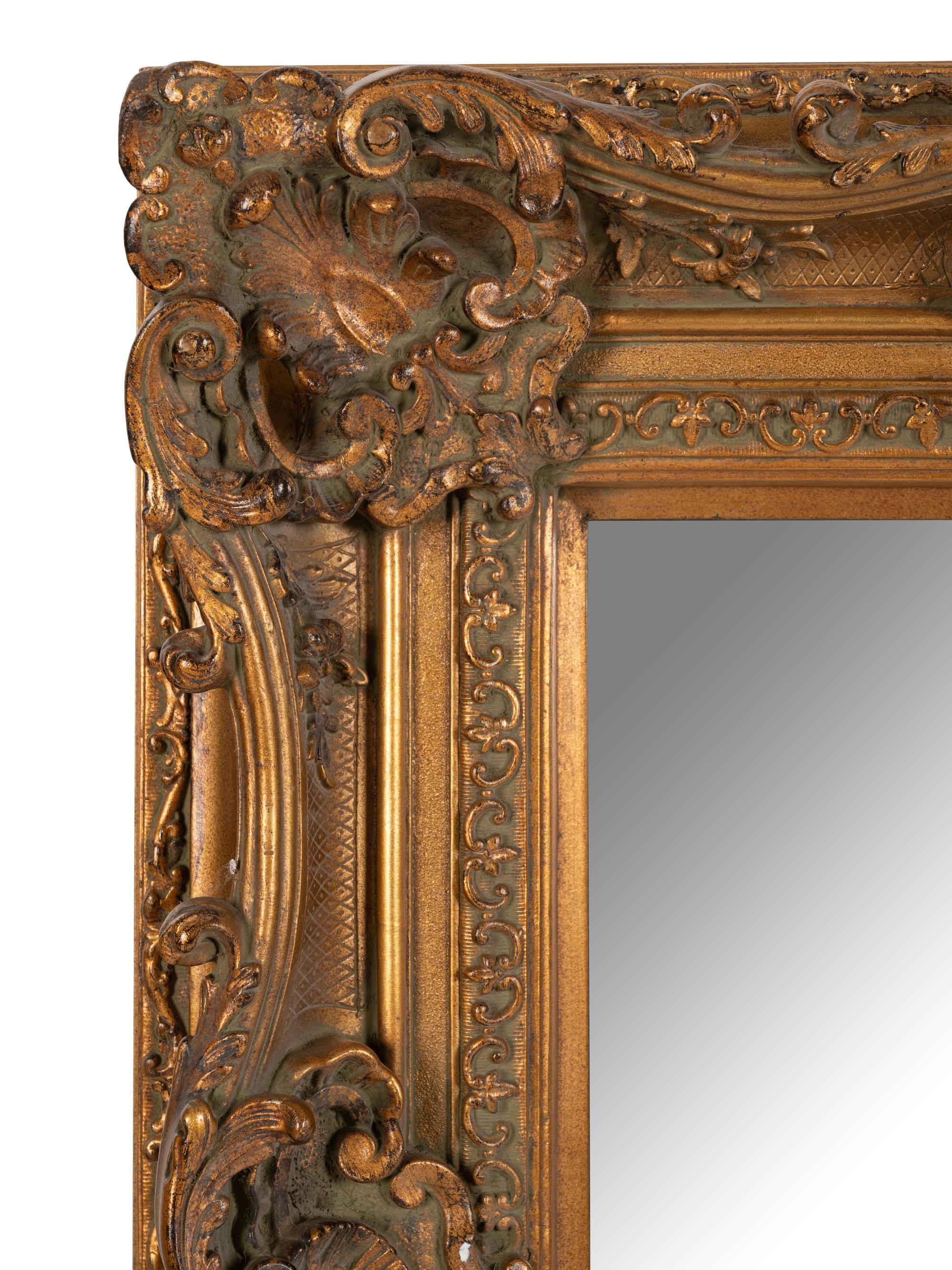 A Baroque Style Giltwood Mirror