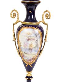 A Pair of Sèvres Style Gilt Metal Mounted Porcelain Covered Urns