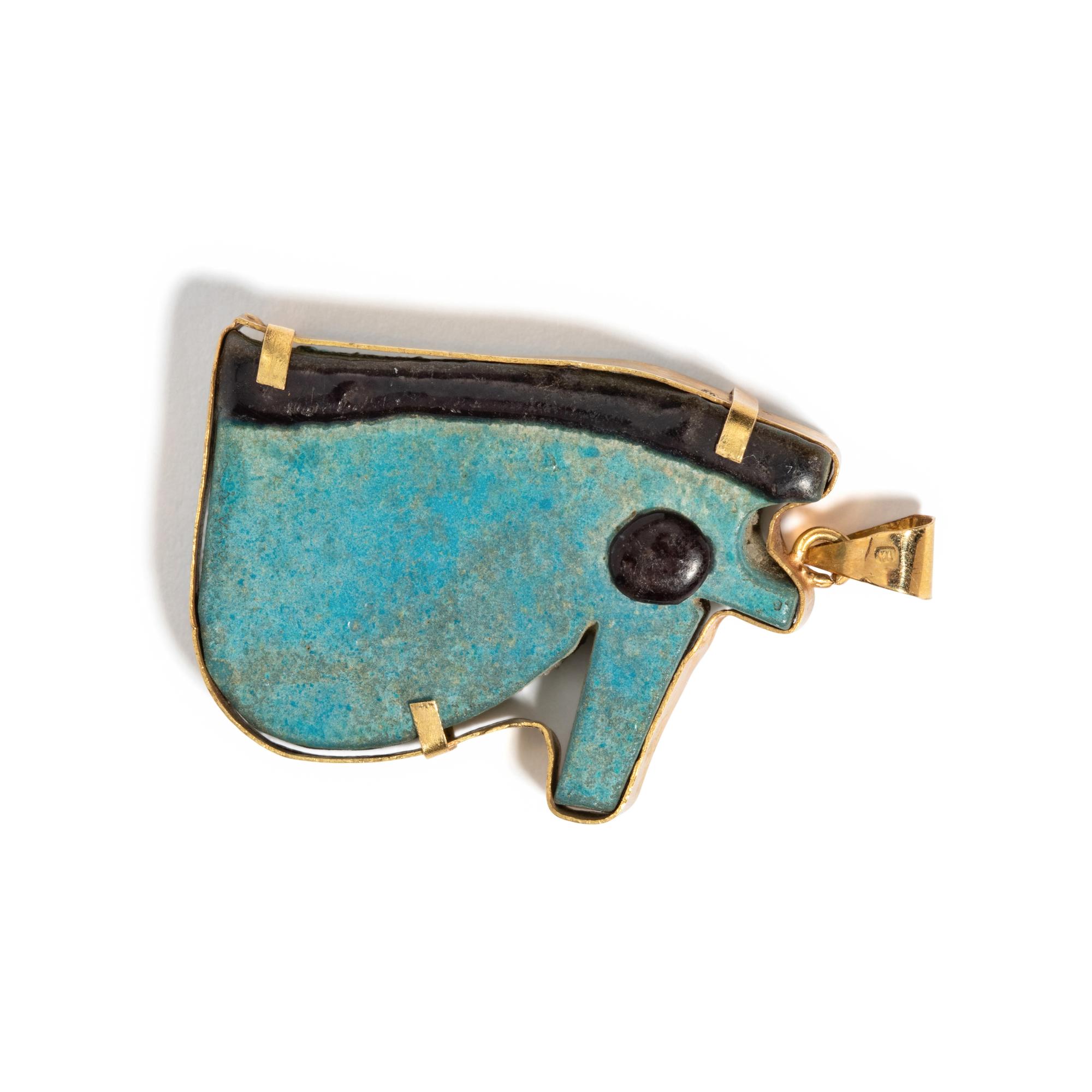 An Egyptian Faience Wadjet — Set in a gold pendant
