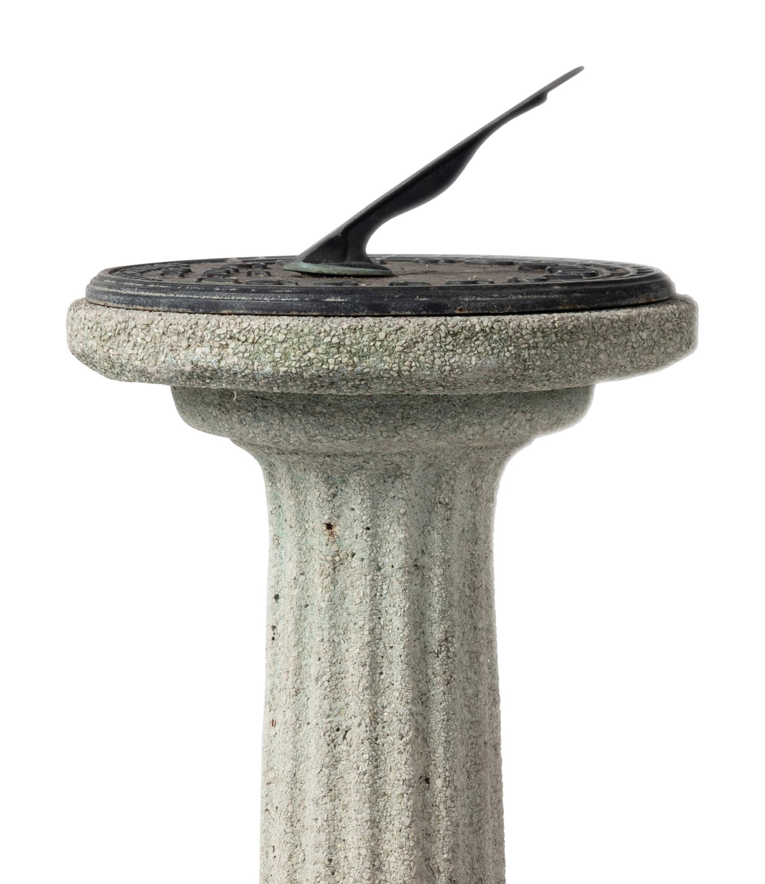 A Bronze Sundial on a Cast Stone Pedestal