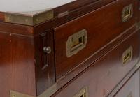 A Diminutive English Campaign Style Brass Mounted Mahogany Chest of Drawers — 20TH CENTURY