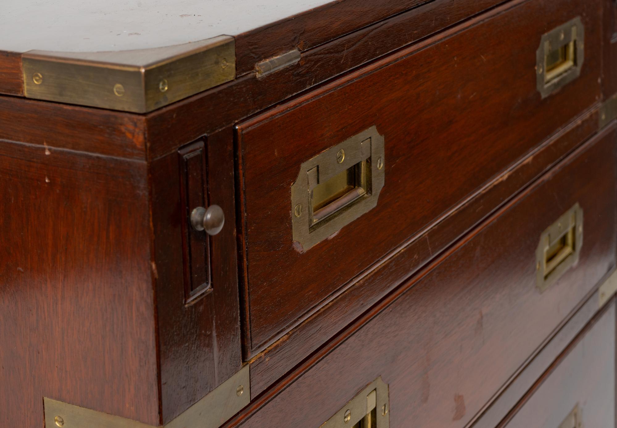 A Diminutive English Campaign Style Brass Mounted Mahogany Chest of Drawers — 20TH CENTURY