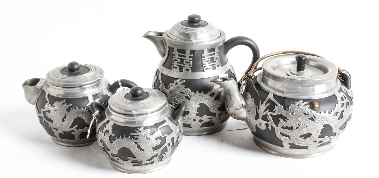 Four Chinese Pewter Mounted Yixing Pottery Tea Pots Height of tallest 6 1/8 inches. — LATE QING DYNASTY/REPUBLIC PERIOD