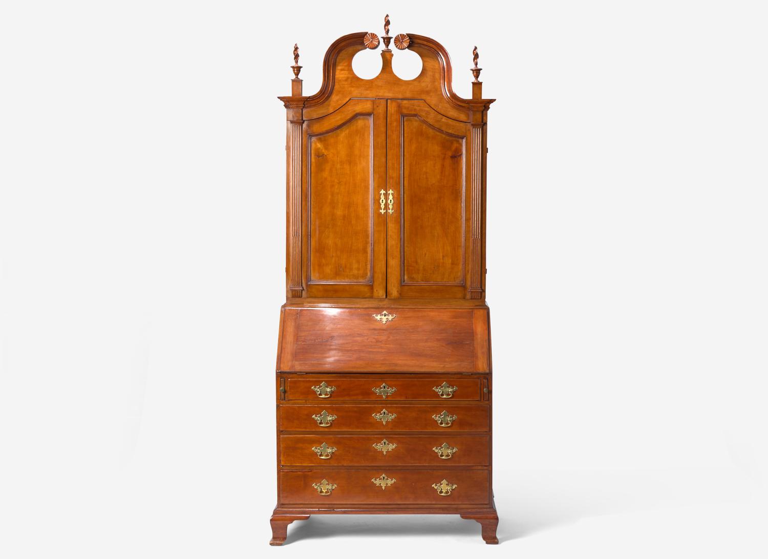 A Chippendale Carved Cherrywood Desk and Bookcase