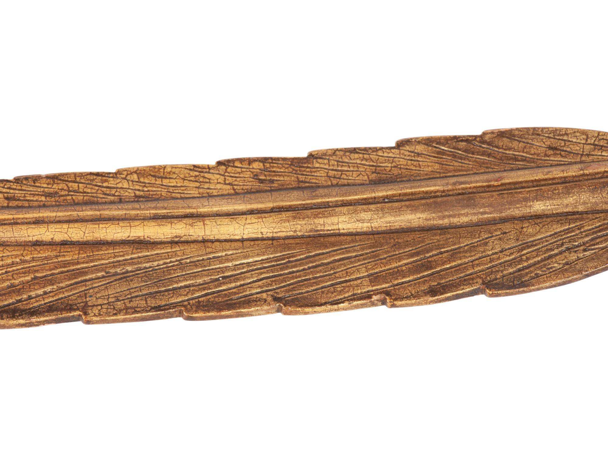 A Wooden Parcel Gilt Quill Weather Vane Fragment