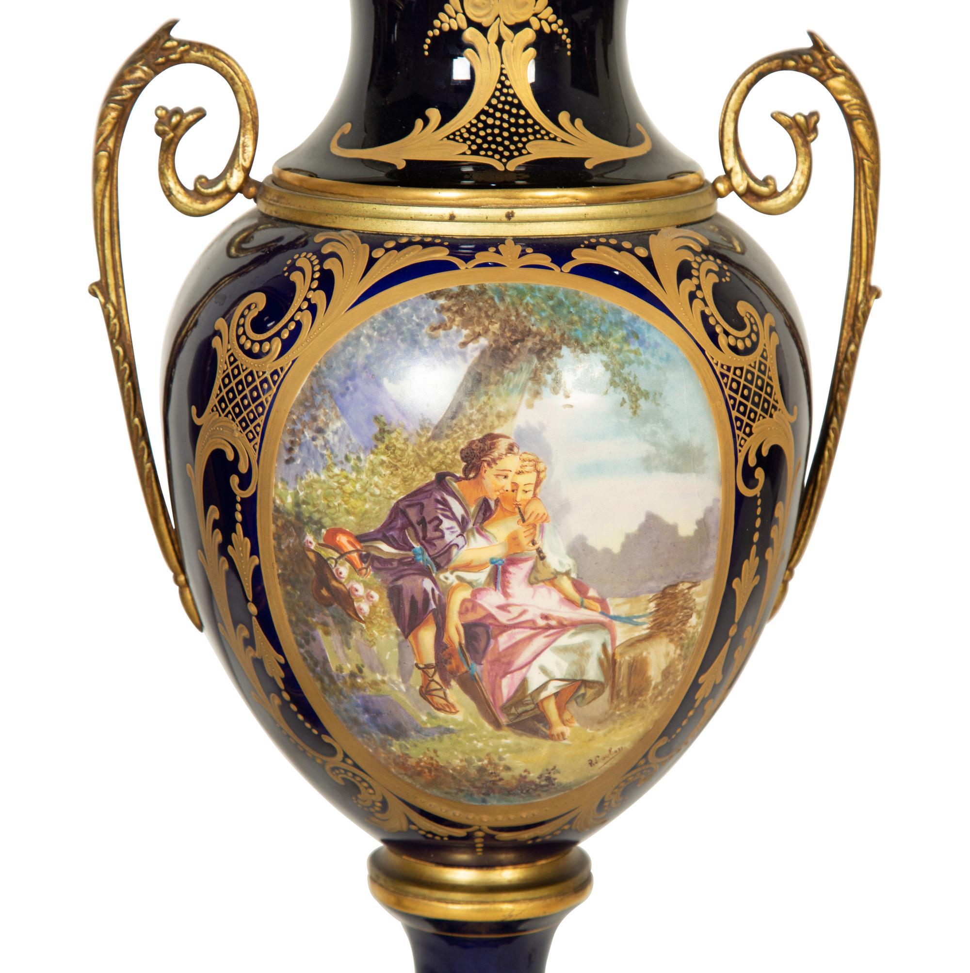 A Pair of Sèvres Style Porcelain Urns