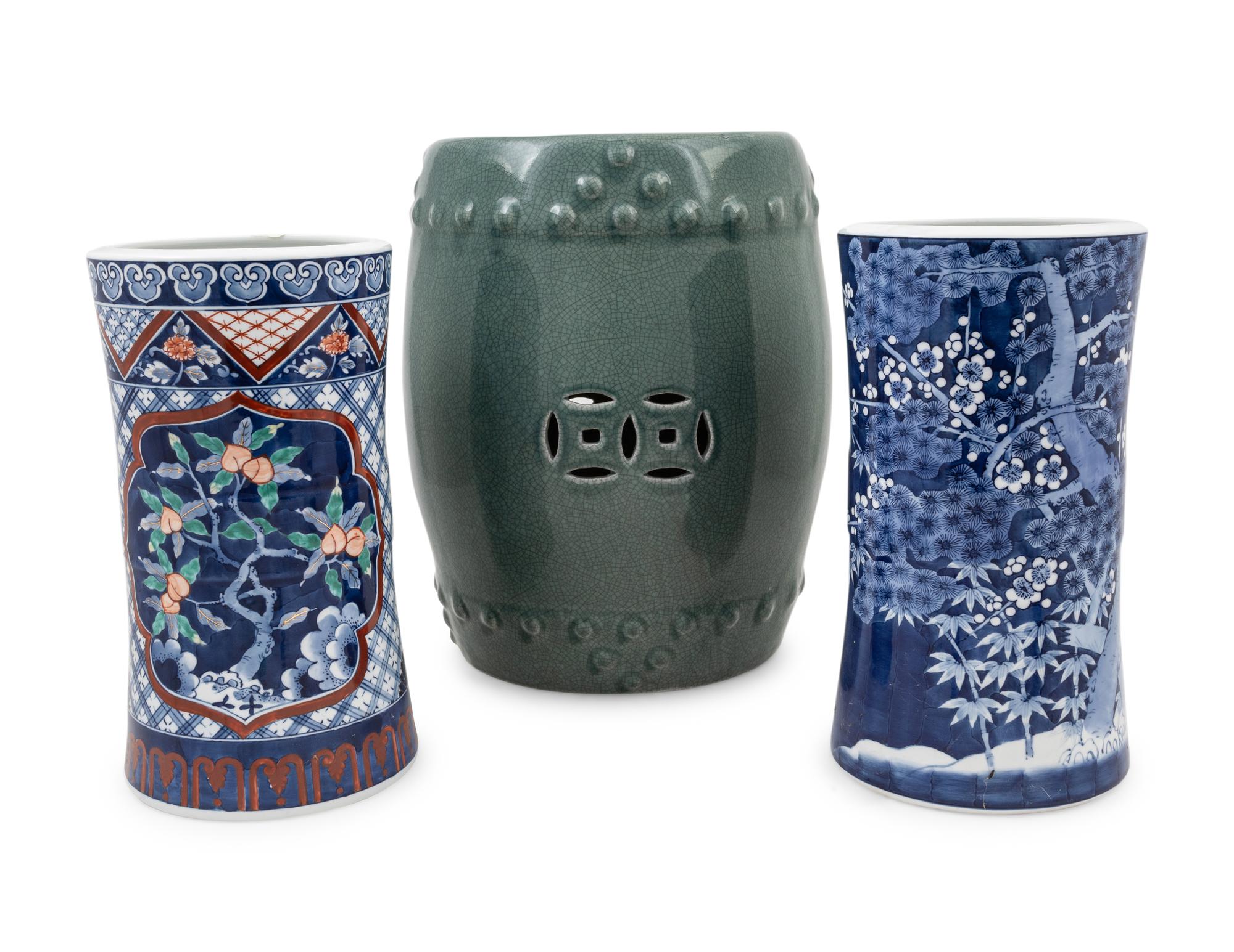 Two Japanese Porcelain Umbrella Stands and A Chinese Celadon Porcelain Barrel-Form Garden Stool
