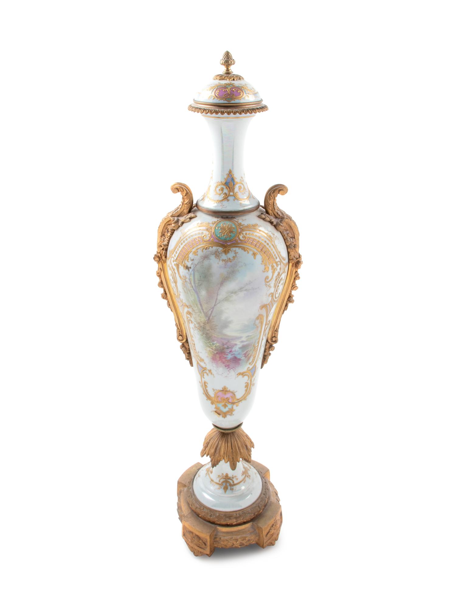 A Large Sèvres Style Gilt Bronze Mounted Painted and Parcel Gilt Porcelain Covered Urn
