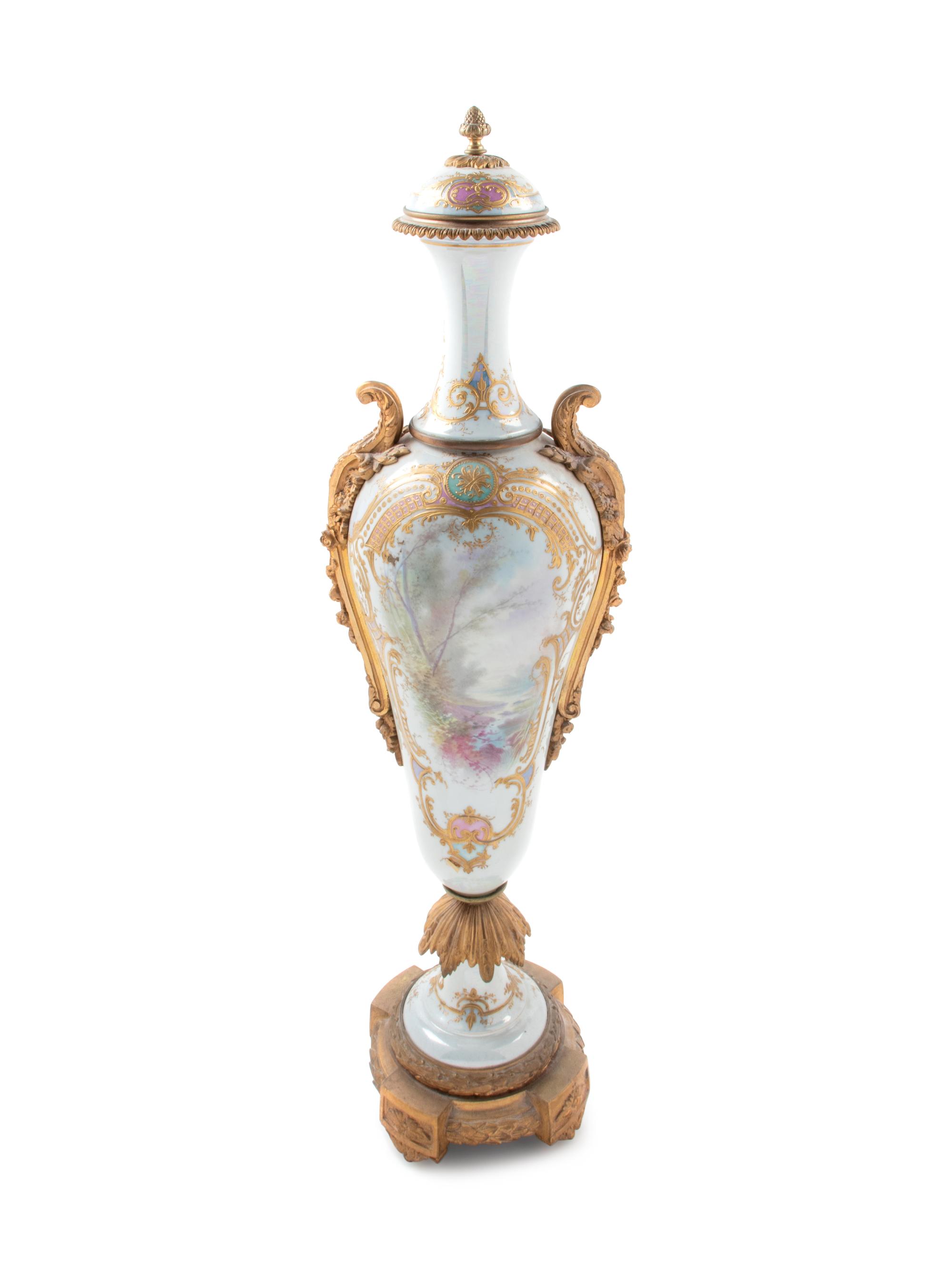 A Large Sèvres Style Gilt Bronze Mounted Painted and Parcel Gilt Porcelain Covered Urn