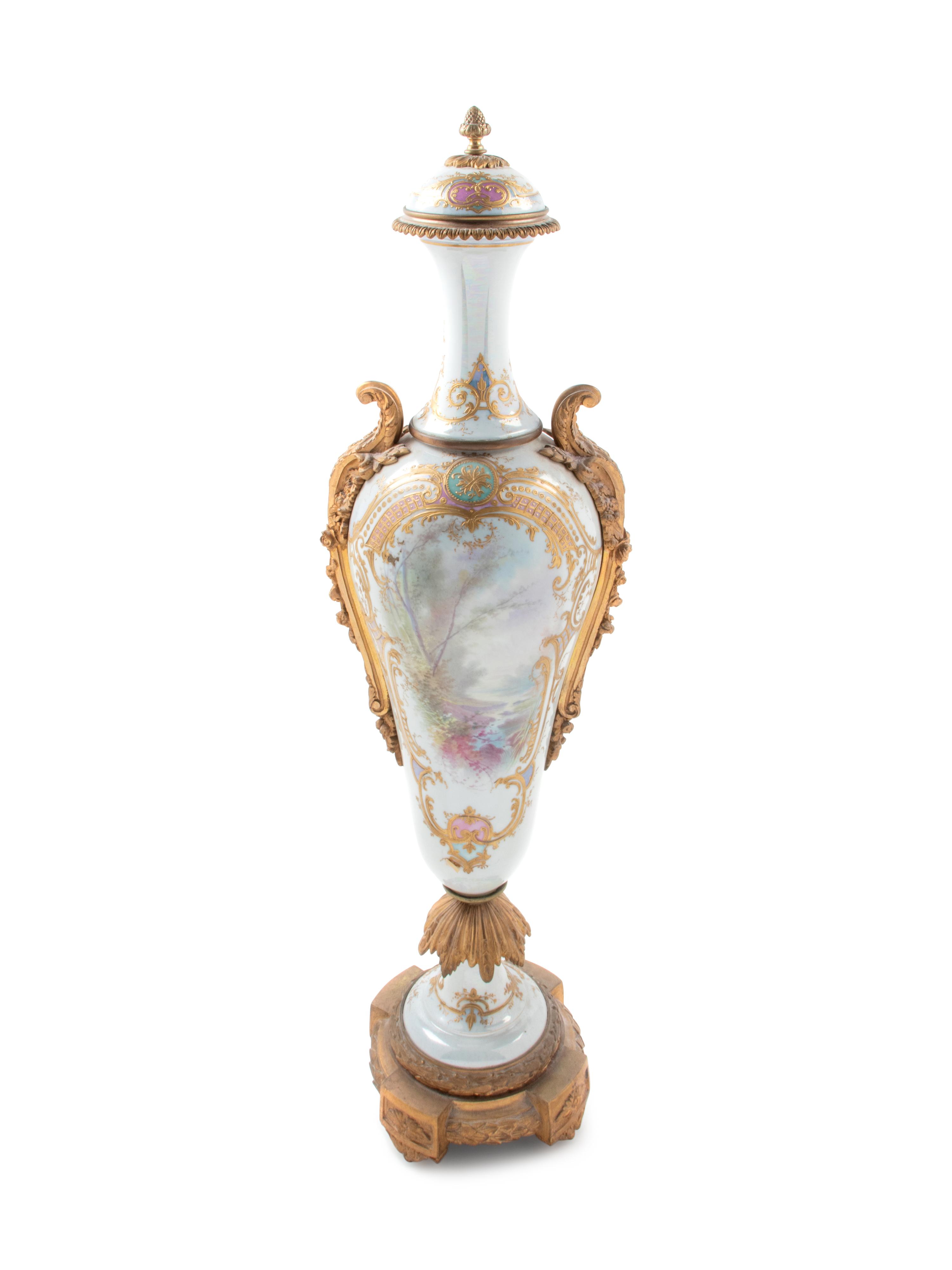 A Large Sèvres Style Gilt Bronze Mounted Painted and Parcel Gilt Porcelain Covered Urn