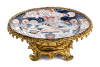 A Gilt Metal Mounted Imari Palette Porcelain Charger Width 14 1/2 inches. — LATE 19TH CENTURY