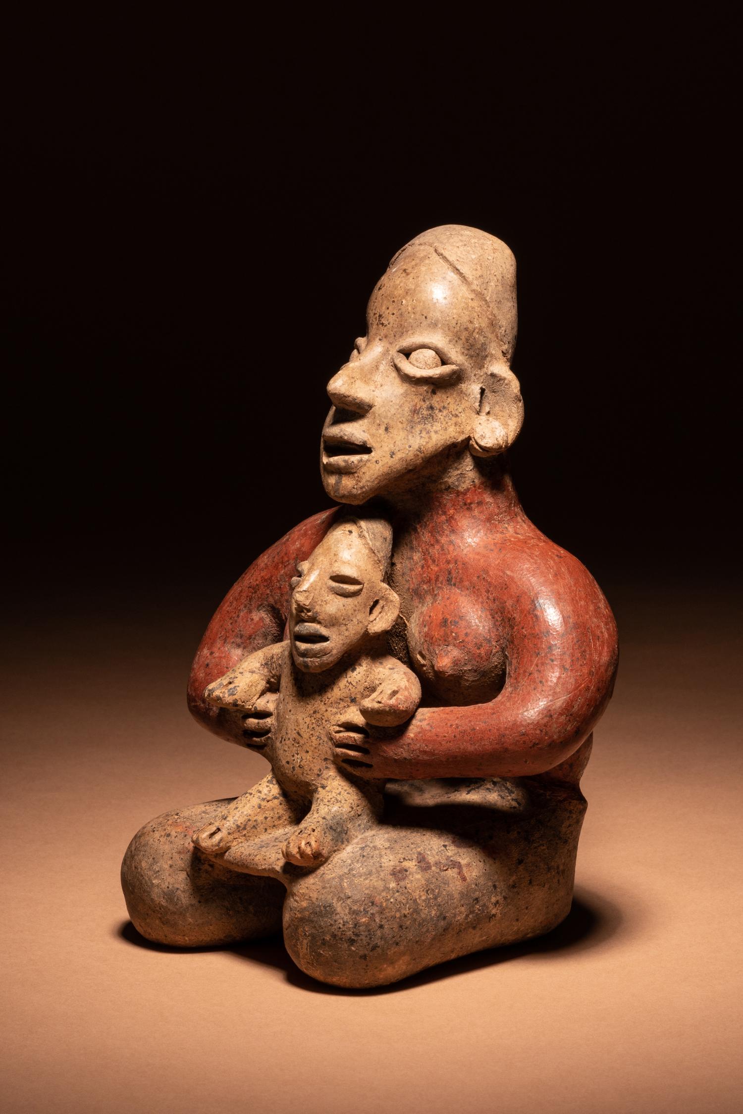 A Jalisco Kneeling Female Figure with Infant