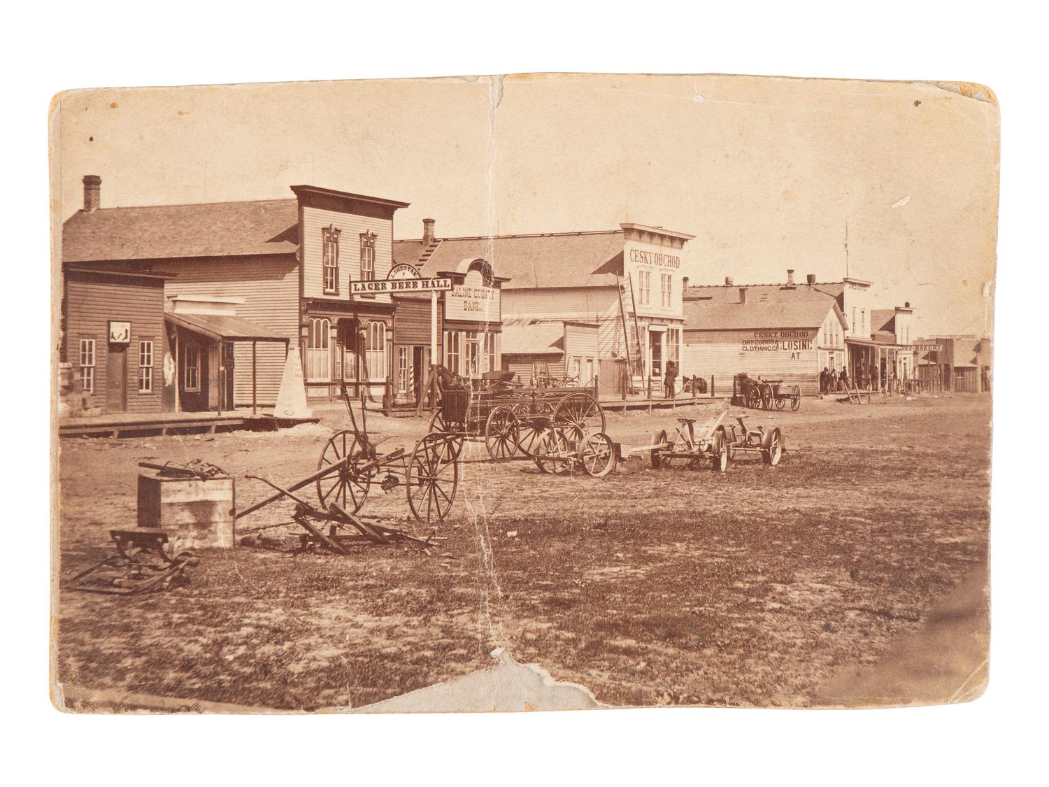 [WESTERN AMERICANA]. 9 photographs of western subjects, incl. street scenes and cowboys.