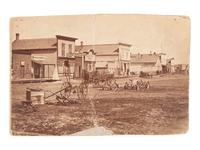 [WESTERN AMERICANA]. 9 photographs of western subjects, incl. street scenes and cowboys.
