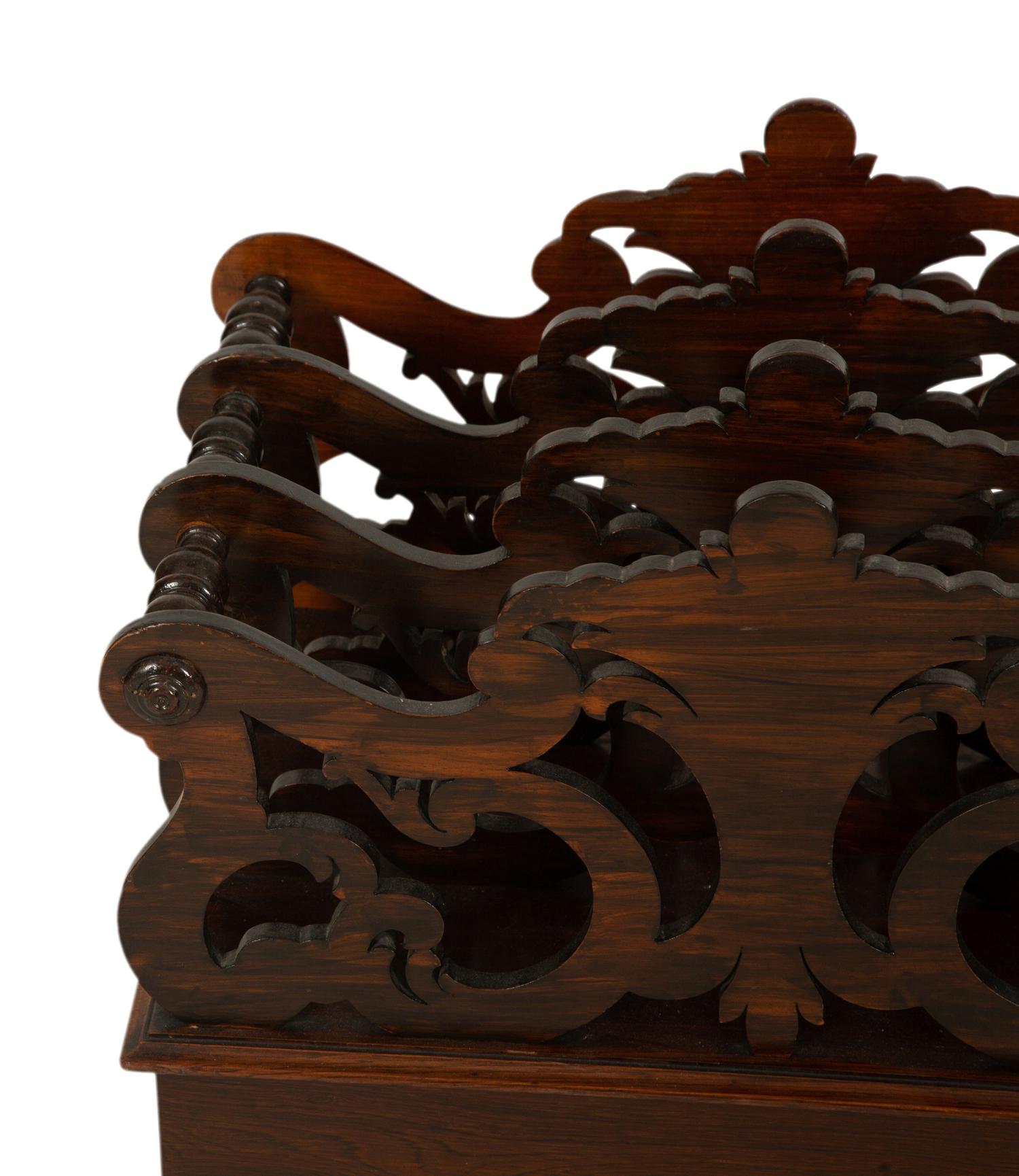 A Late Regency Carved Mahogany Canterbury