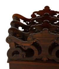 A Late Regency Carved Mahogany Canterbury