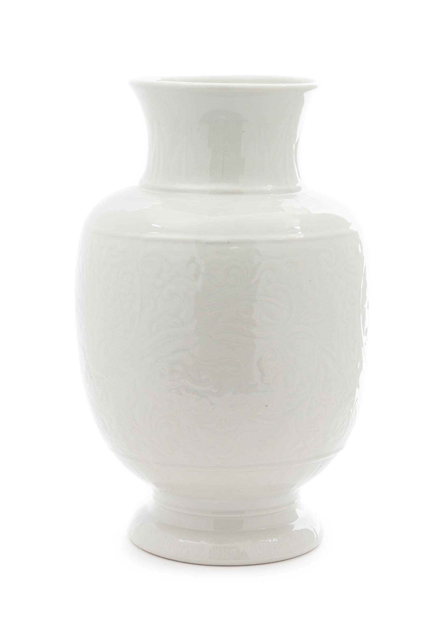 A Chinese Carved White Glazed Porcelain Vase Height 13 1/4 inches. — 20TH CENTURY