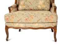 A Pair of Louis XV Style Fruitwood Bergères à Oreilles