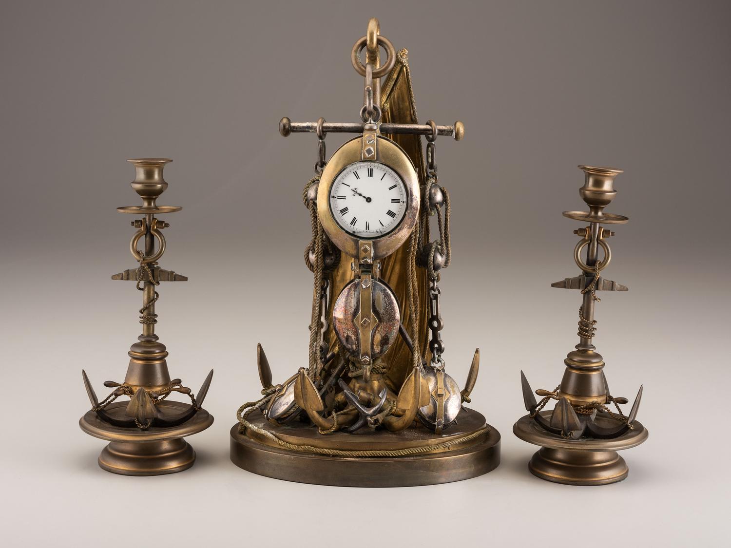 A Cast Brass and Steel Anchor Form Mantel Clock Garniture