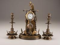 A Cast Brass and Steel Anchor Form Mantel Clock Garniture