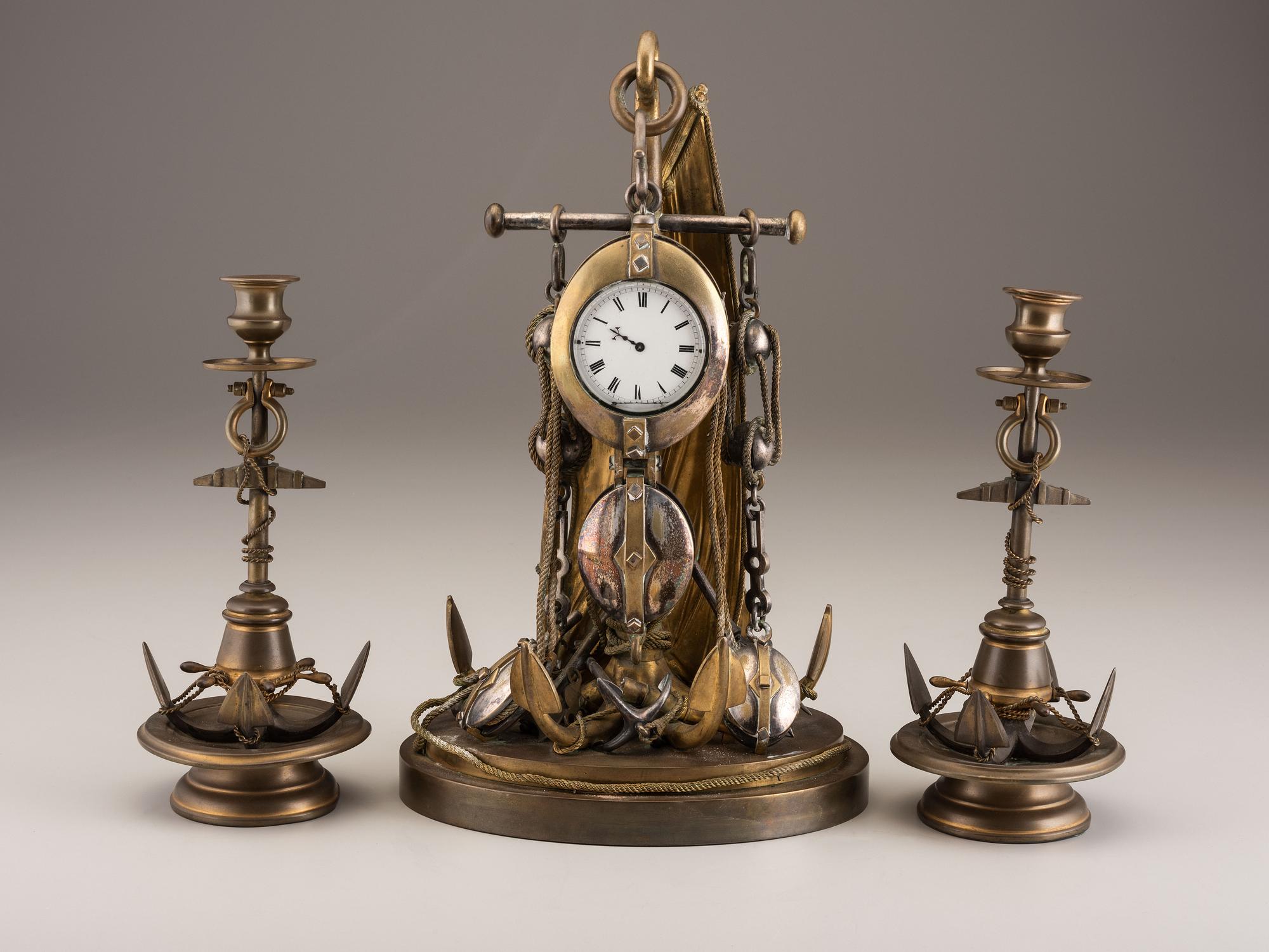A Cast Brass and Steel Anchor Form Mantel Clock Garniture