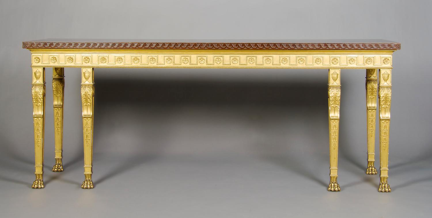 A Neoclassical Parcel Gilt Console Table, Height 33 1/4 x width 84 x depth 24 inches.